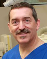 Dr John Vrazas